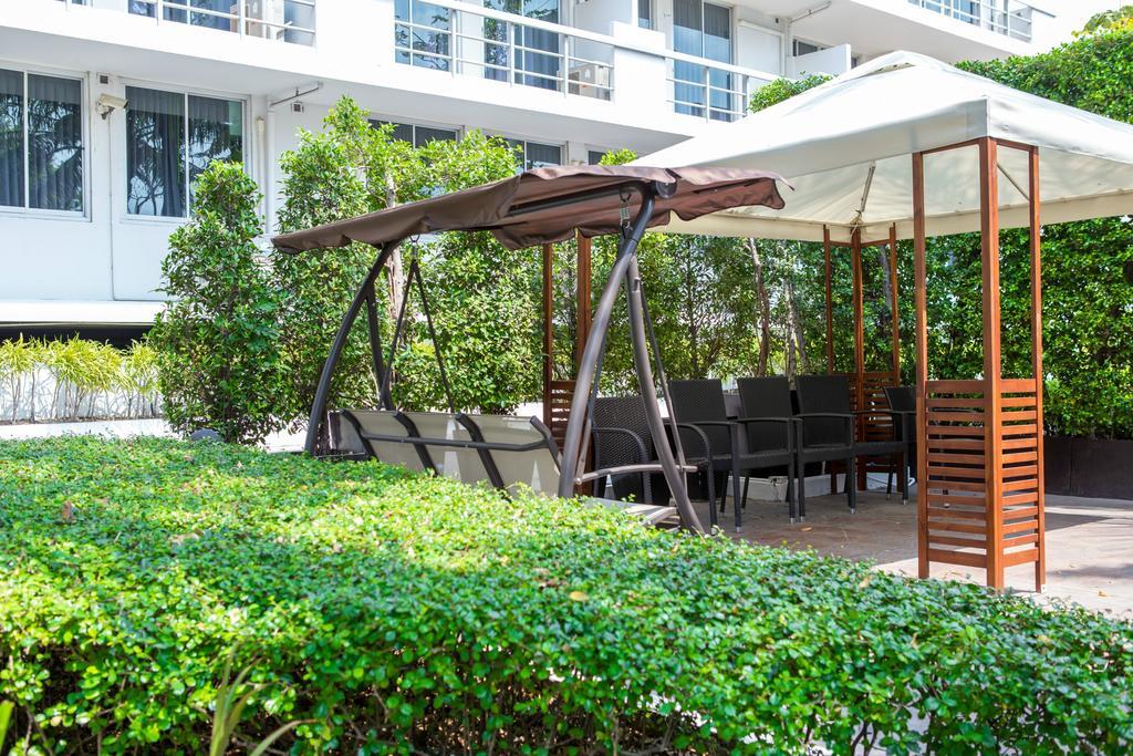 The Capital Resort @ Sukhumvit 50 Bangkok Exterior photo A pergola with a swing