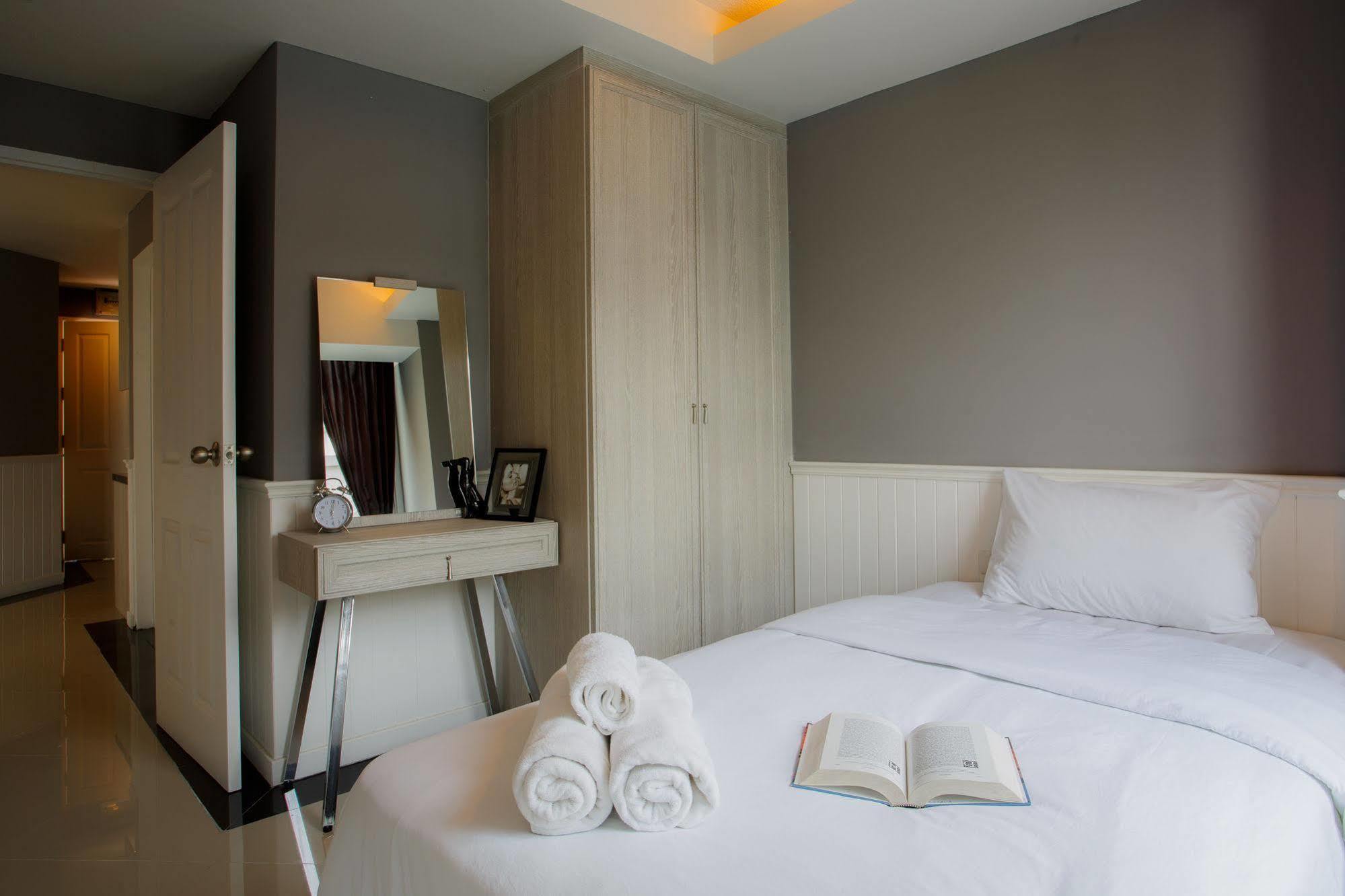 The Capital Resort @ Sukhumvit 50 Bangkok Exterior photo A bedroom in a serviced apartment in Bangkok, Thailand