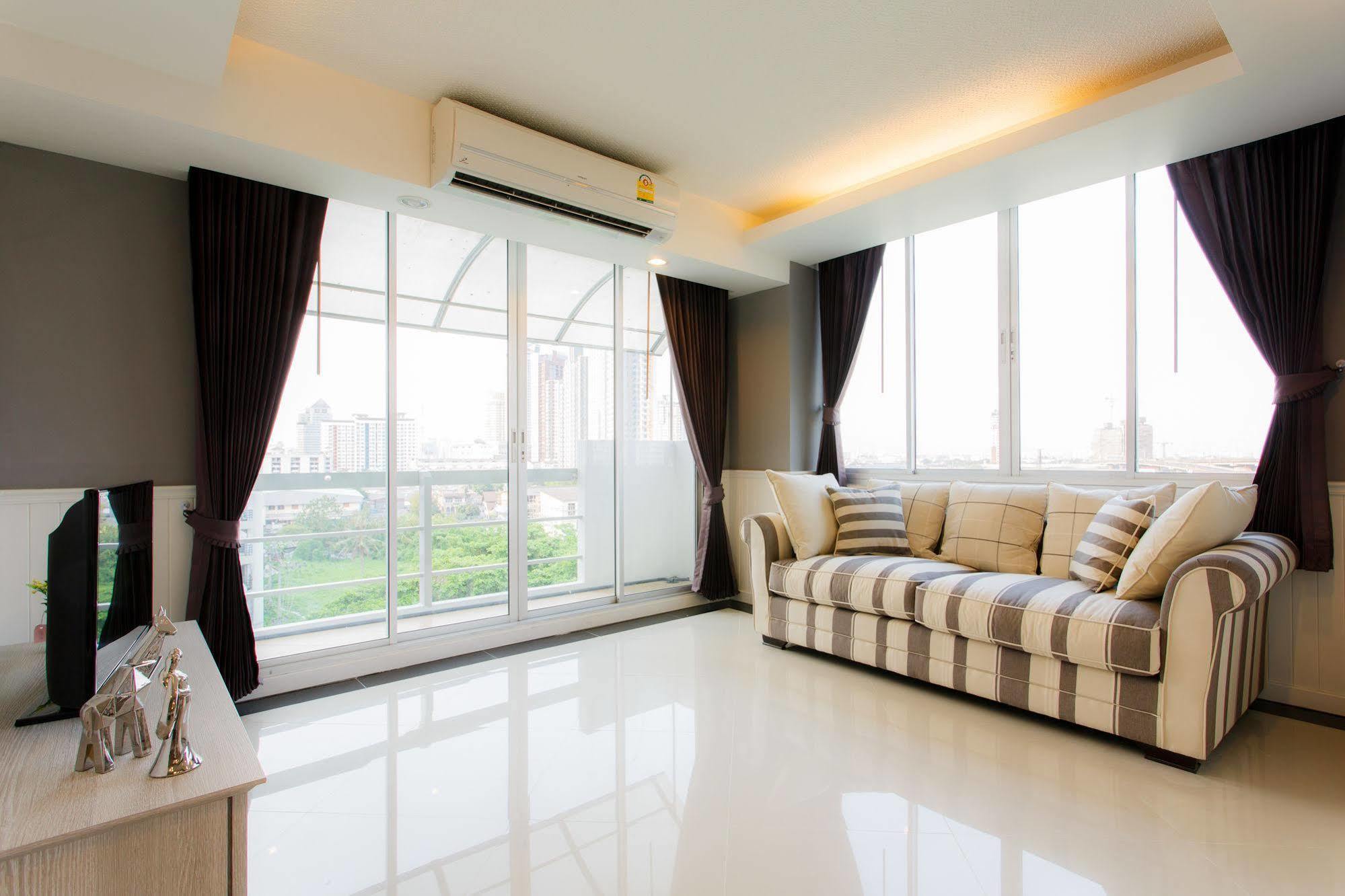 The Capital Resort @ Sukhumvit 50 Bangkok Exterior photo A living room with a sofa