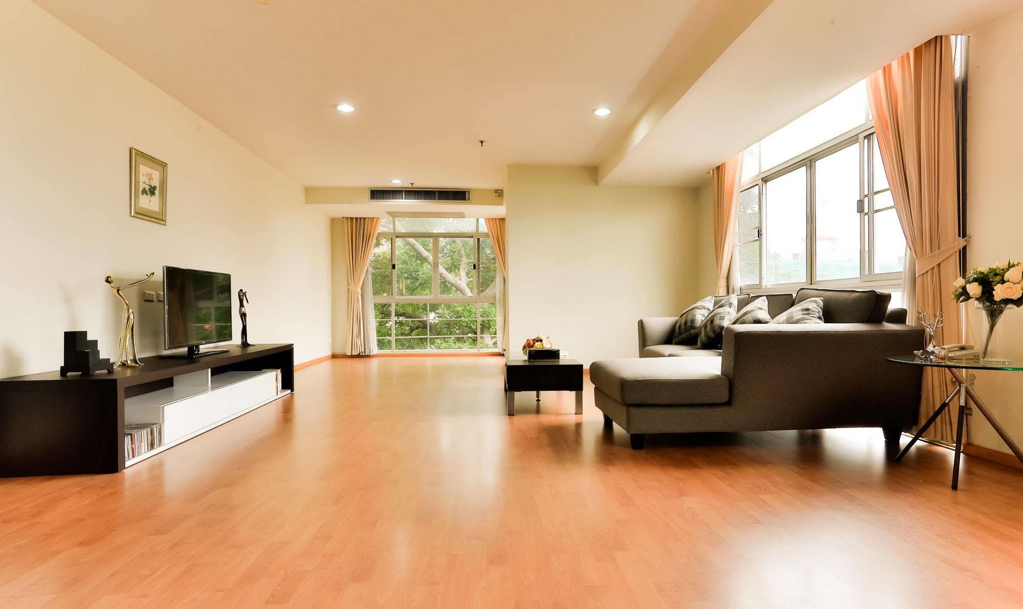 The Capital Resort @ Sukhumvit 50 Bangkok Exterior photo A living room with a laminate wood floor